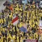 Mahasiswa berjalan saat aksi unjuk rasa di Jalan Jenderal Sudirman, Jakarta, Jumat (12/6/2026). ( poto : kompas.com )