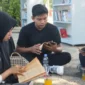 Dinas Perpustakaan dan Kearsipan (Dispusip) Kota Padang menghadirkan taman bacaan luar ruang di halaman kantor.(poto: padangkita.com).