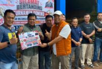 Sekretaris Daerah Merangin Zulhifni bersama pasangannya Deni Auriza sukses mengamankan gelar juara pertama pada Turnamen Domino HUT RI ke-81.(poto: kominfo).