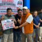 Sekretaris Daerah Merangin Zulhifni bersama pasangannya Deni Auriza sukses mengamankan gelar juara pertama pada Turnamen Domino HUT RI ke-81.(poto: kominfo).