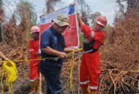 Kementerian Lingkungan Hidup/Badan Pengendalian Lingkungan Hidup (KLH/BPLH) mengambil tindakan tegas dengan menyegel area konsesi PT BHP di Kabupaten Ogan Komering Ilir, Sumatera Selatan.(poto: kompas.com).